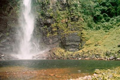 A waterfall-fed lagoon near the base of the plateau